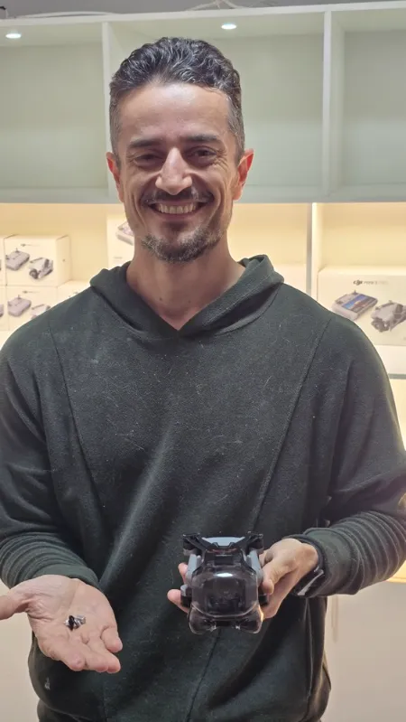 Customer holding his repaired drone